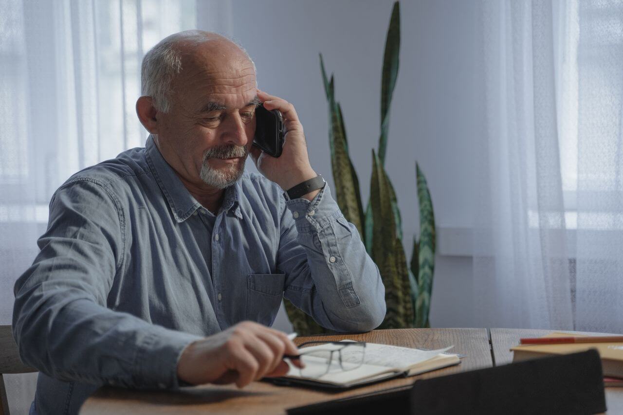 Older man talking on phone