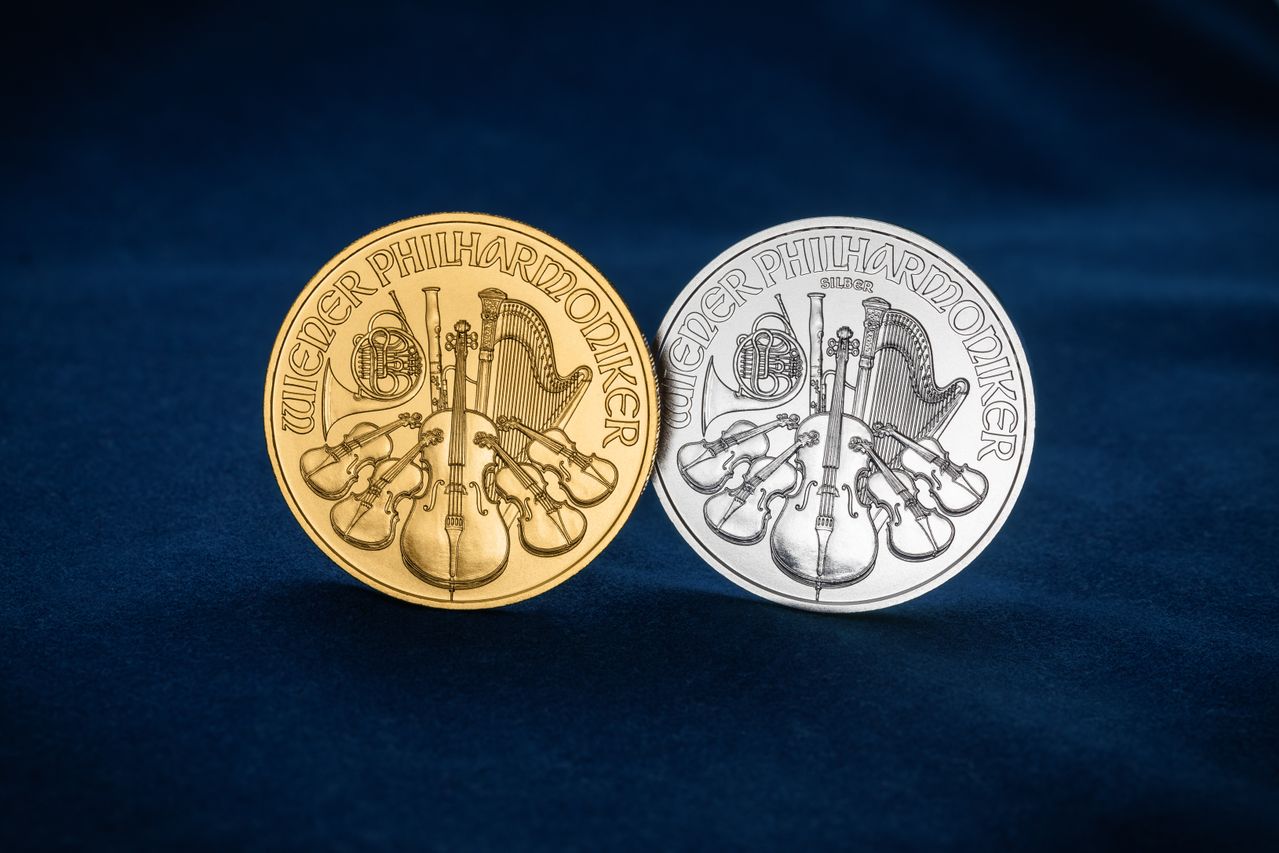 An IRA-approved gold coin and an IRA-approved silver coin