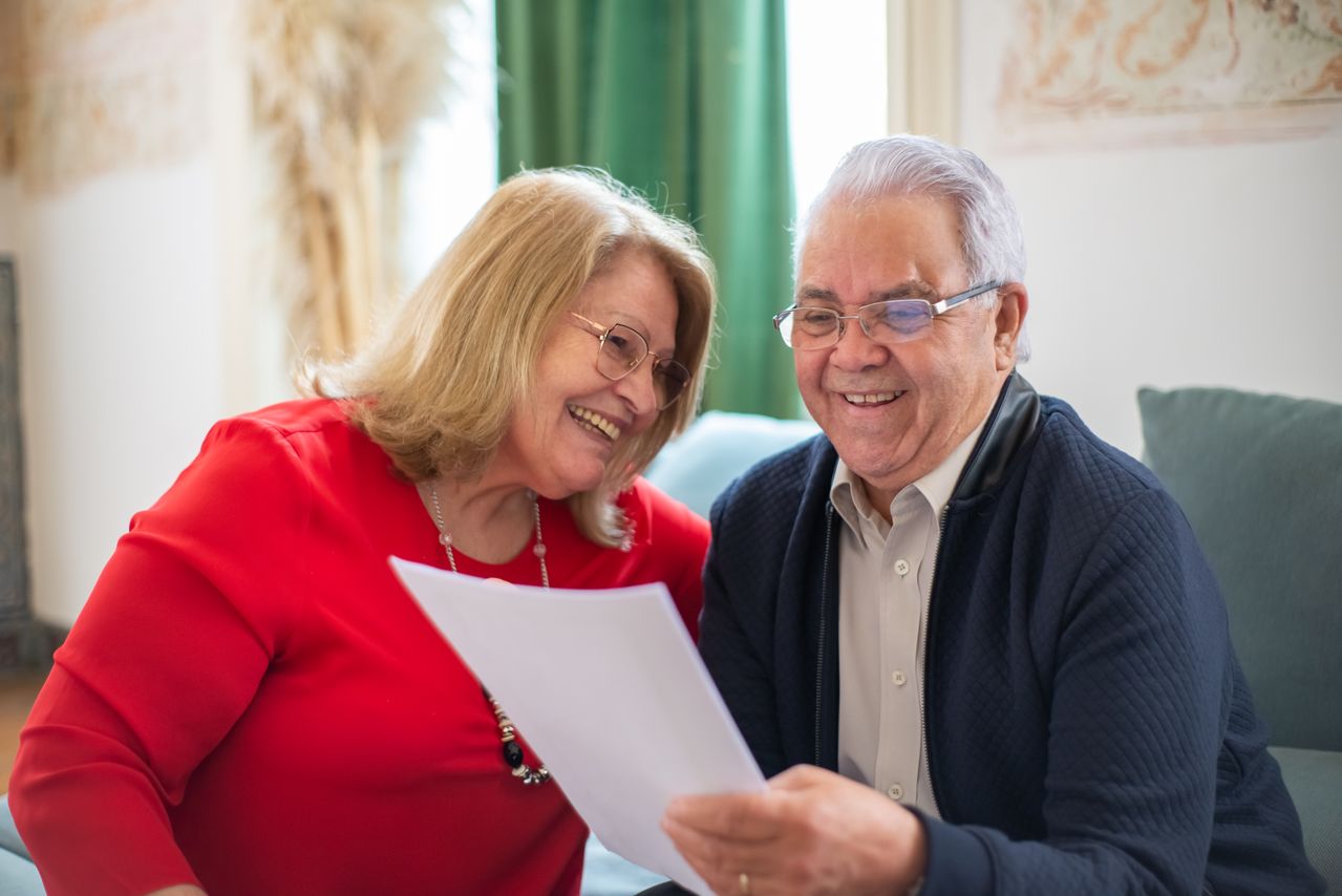 Elderly couple reviewing finances