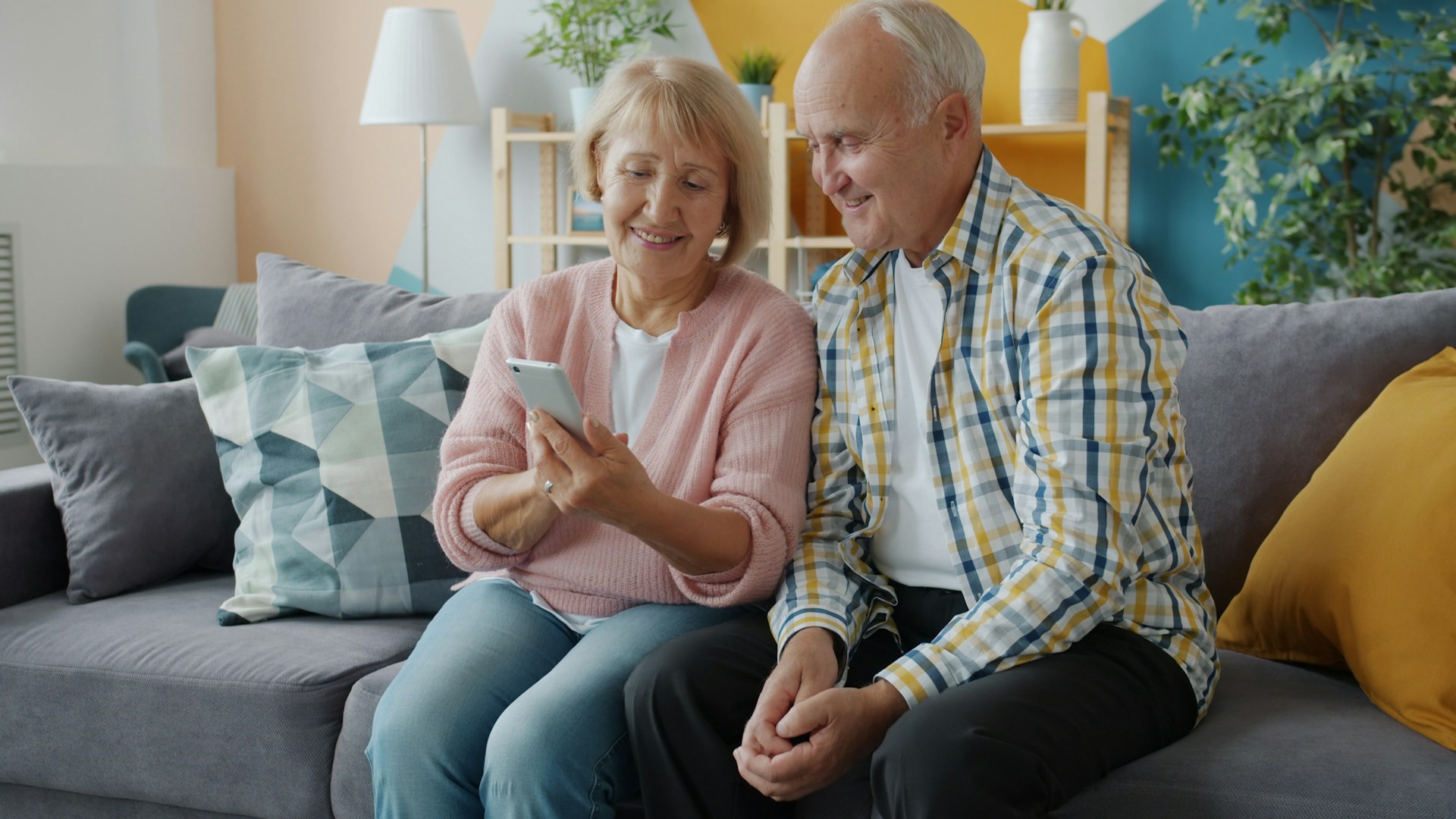 Elderly couple calling for a consultation about their conservative investment strategy