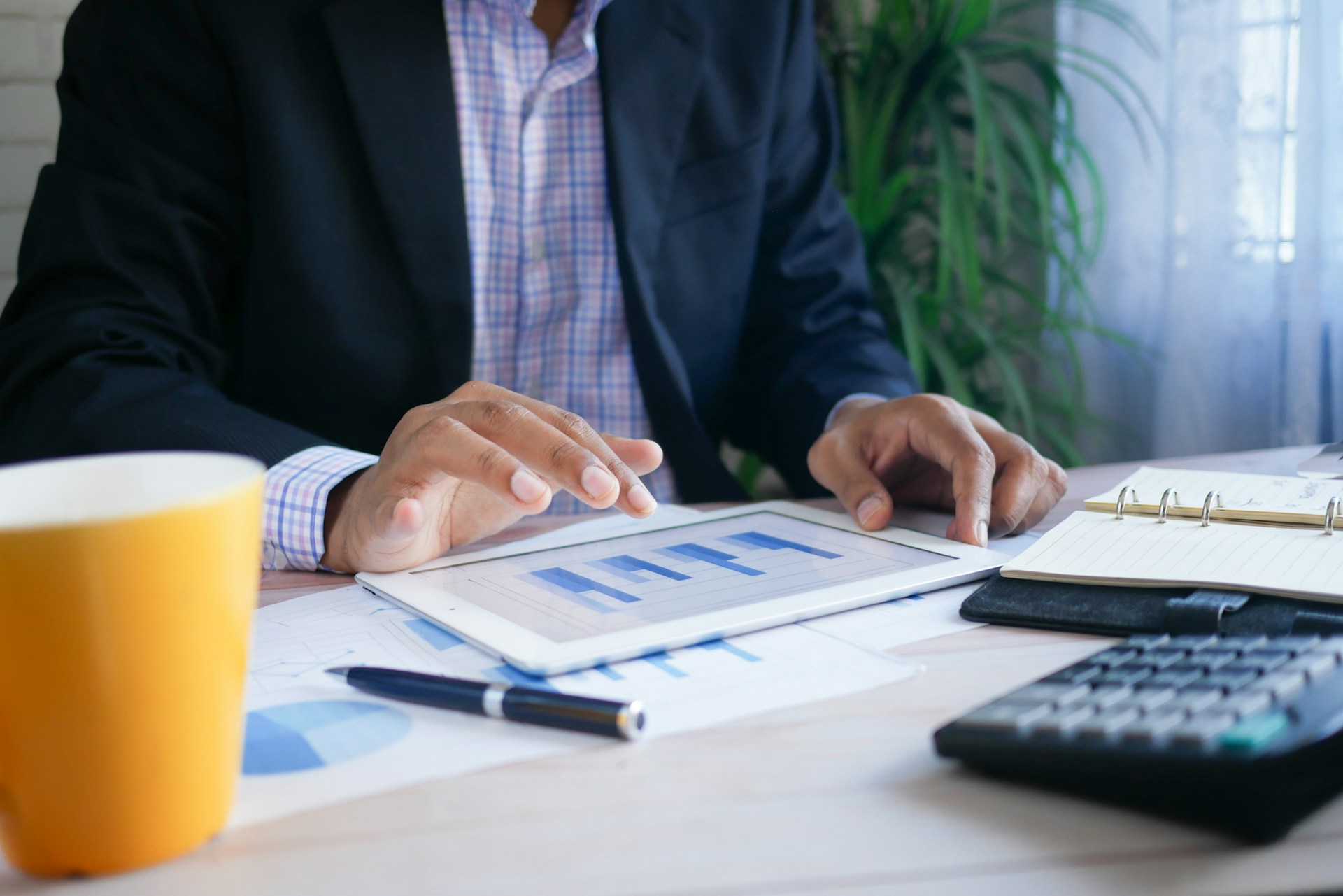 Person analyzing financial charts for investing during recession