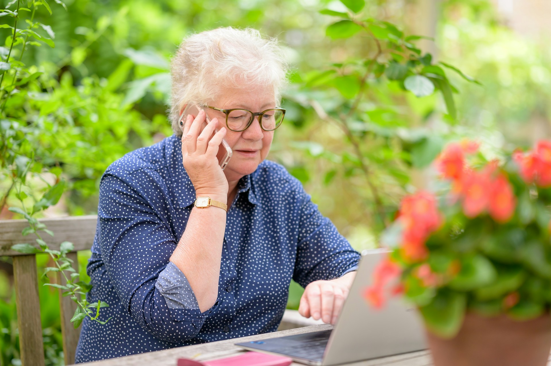 Elderly woman on a phone consultation about the best-performing assets