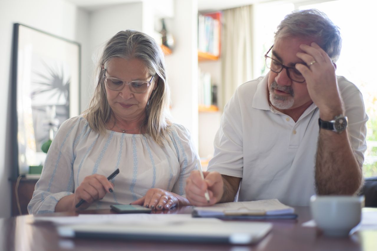 Elderly couple planning a simple investment strategy 